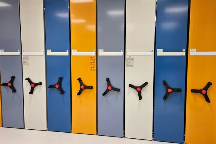 Colourful mobile shelving with metal fronts