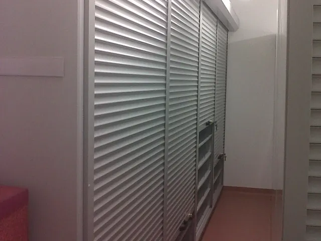 Tall archive shelving with roller shutter