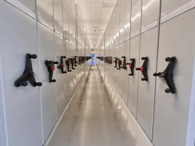Long row of white mobile shelving