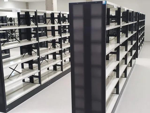 Black warehouse shelving arranged in rows